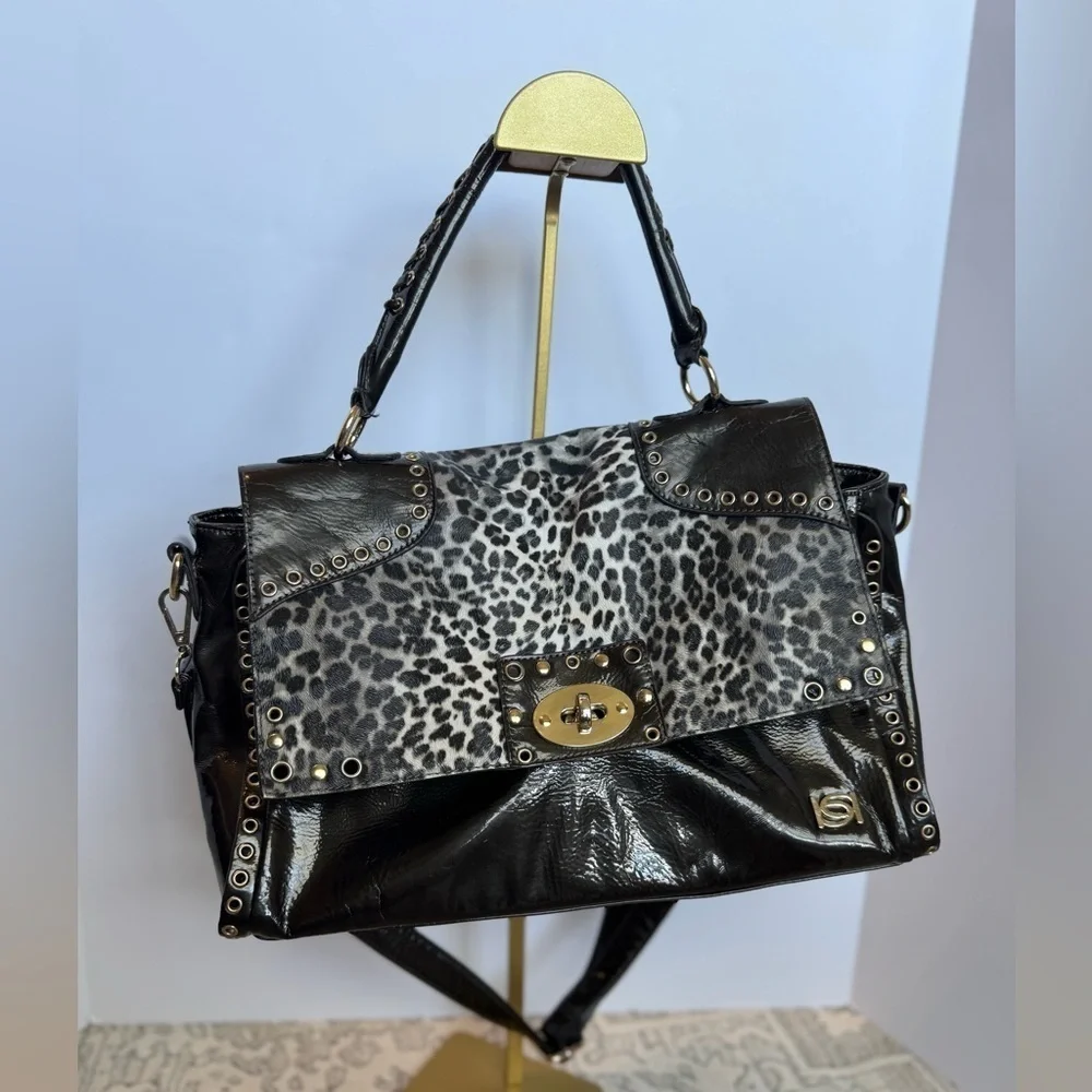 BEBE Large Handbag Leopard Grommet in Black and gray and gold